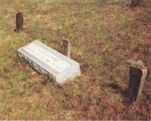 Charlie Silver's original three graves along with a new marker.