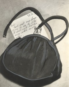 Jean's purse as it was found with the strap broken.