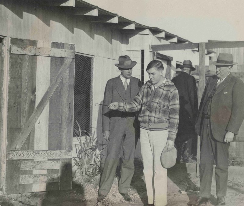 Gordon Northcott guides detectives around the chicken coop where the murders happened.