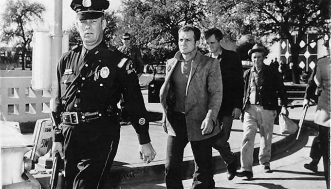 The "three tramps" under police escort immediately following the assassination of President John F. Kennedy
